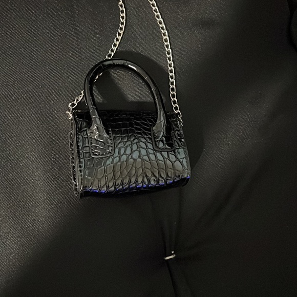 I am selling this mini black purse bought for 20$ now 15$ get it while you can - Picture 2 of 2